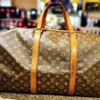 Grand sac de voyage monogrammé restauré